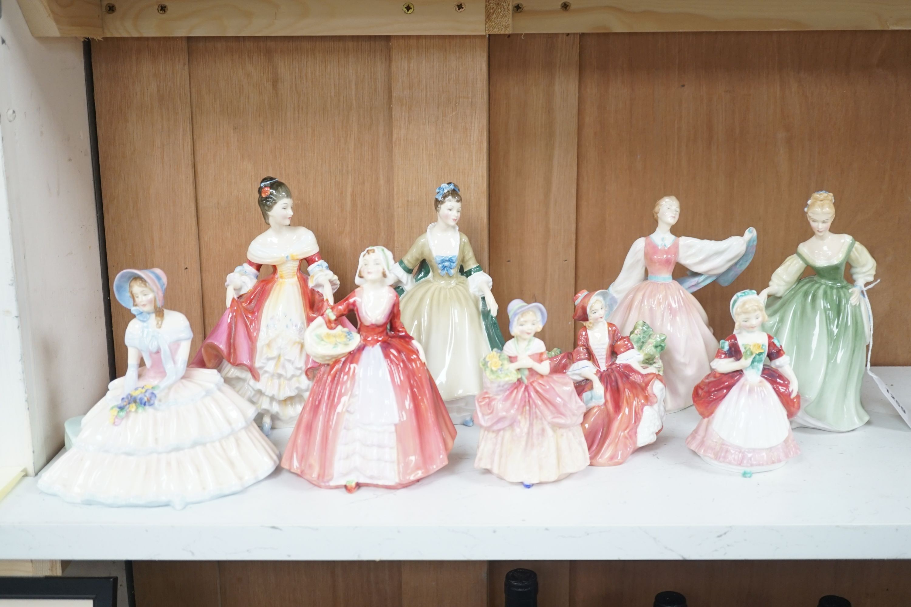 6 Royal Doulton figurines and 3 smaller figurines, Fair Lady HN2193, Gay Morning HN2135, Cissie HN1809, Valerie HN2107, Elegance HN2264, Lydia HN1908, Janet HN1537, Day Dreams HN1731 and Southern Bell HN2229